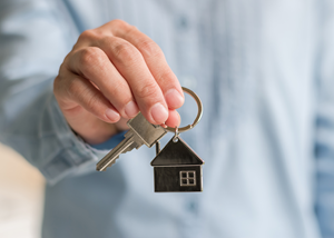 man holding house key